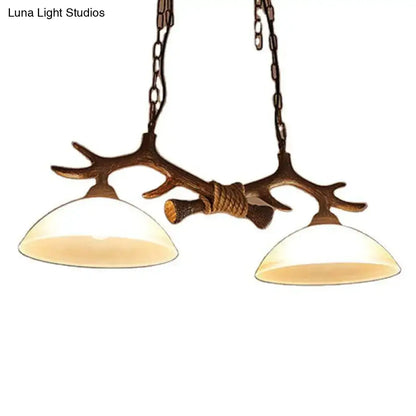 Rustic antler decor dark coffee island light beige glass dining room