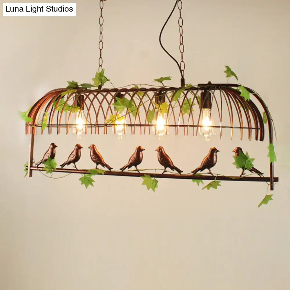 Rustic black birdcage pendant light dining room with vine and birds