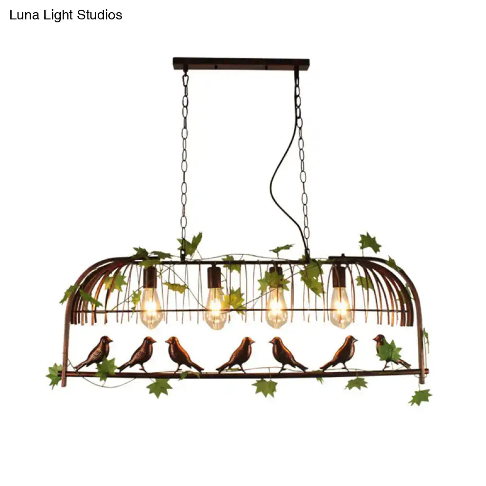 Rustic black birdcage pendant light dining room with vine and birds
