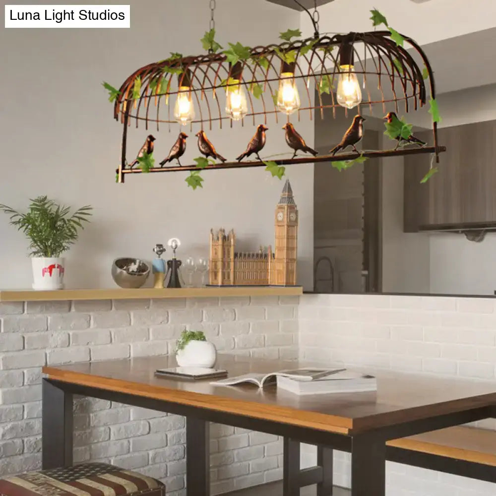 Rustic black birdcage pendant light dining room with vine and birds