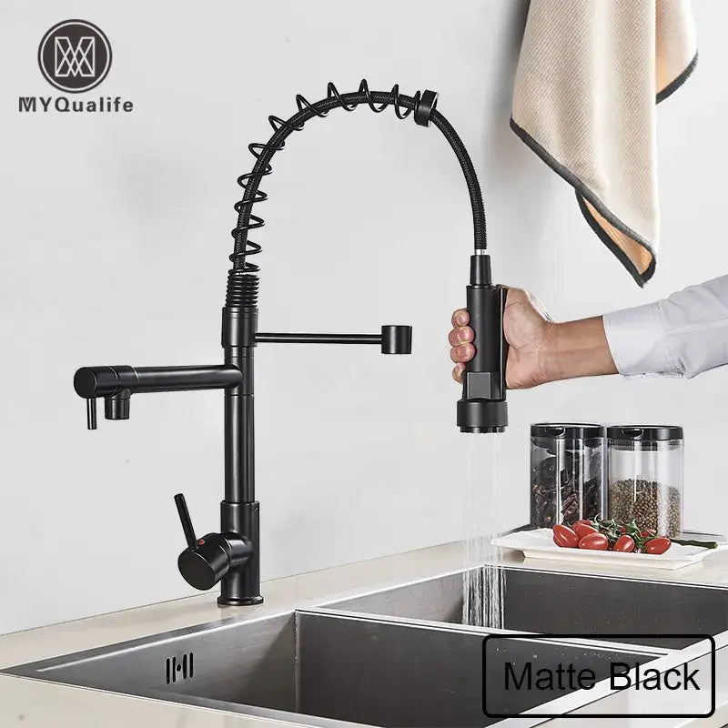 black brass kitchen faucet with dual spout and pull down spray