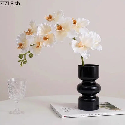 Minimalist purple & blue orchid in black glass vase living room decor