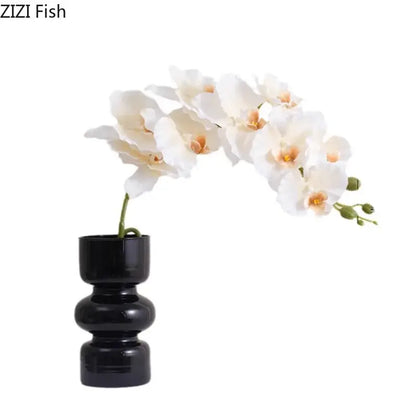 Minimalist purple & blue orchid in black glass vase living room decor