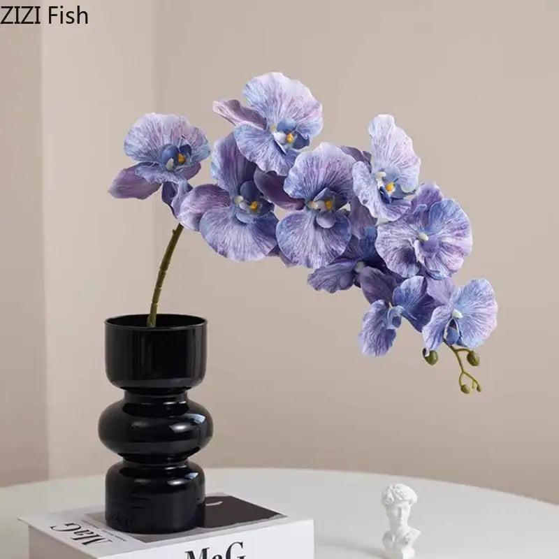 Minimalist purple & blue orchid in black glass vase living room decor