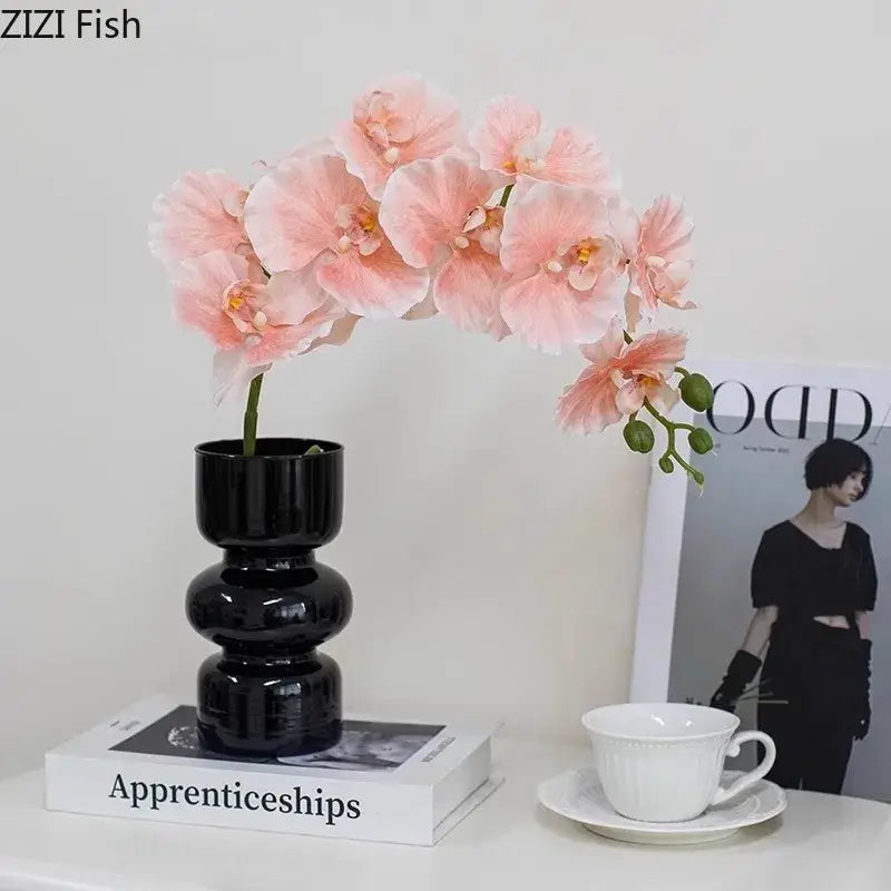 Minimalist purple & blue orchid in black glass vase living room decor