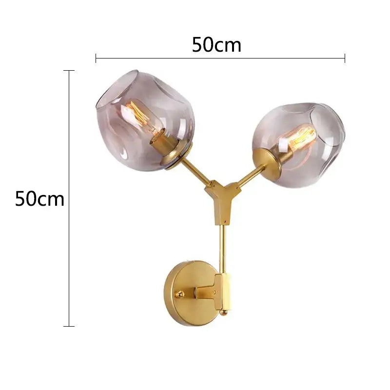 Modern black & gold wall lamps with frosted glass globes for bedroom