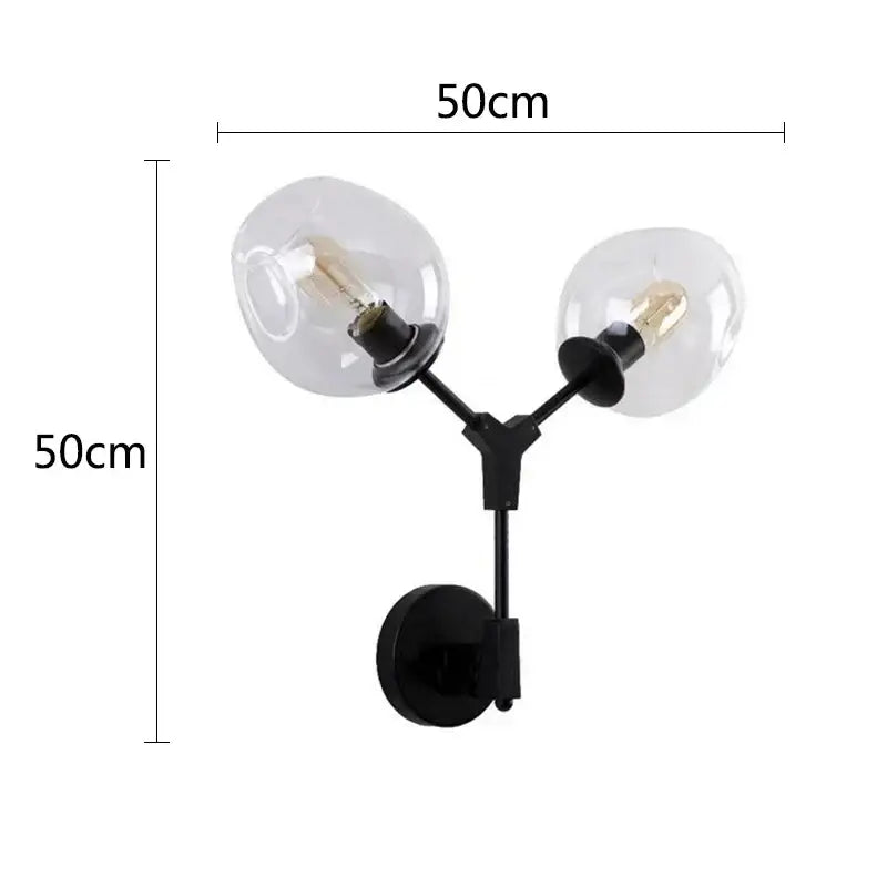 Modern black & gold wall lamps with frosted glass globes for bedroom