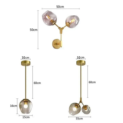 Modern black & gold wall lamps with frosted glass globes for bedroom
