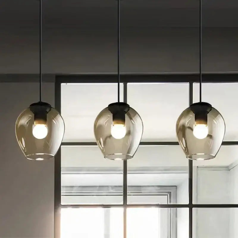 Modern black & gold wall lamps with frosted glass globes for bedroom