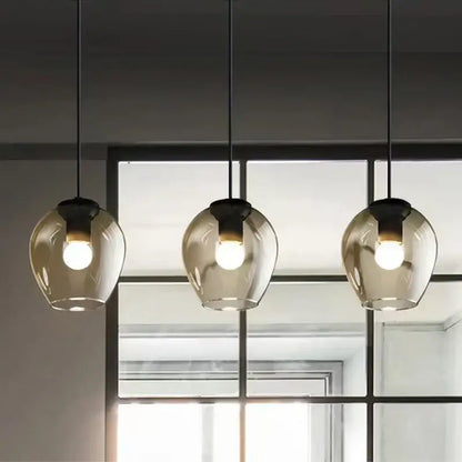 Modern black & gold wall lamps with frosted glass globes for bedroom