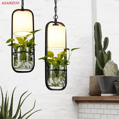 Industrial black iron cage pendant light with plant holder dining room