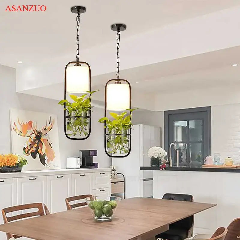 Industrial black iron cage pendant light with plant holder dining room