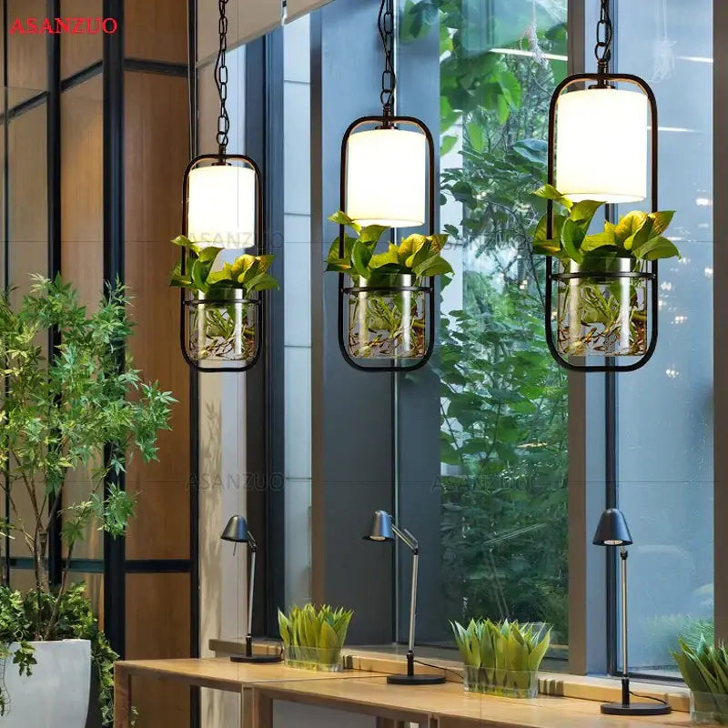 Industrial black iron cage pendant light with plant holder dining room