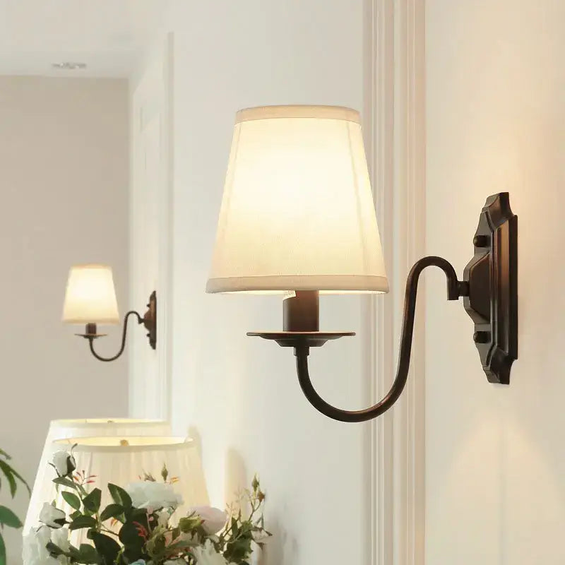 Antique bronze iron wall lamp with cream fabric shade for bedroom