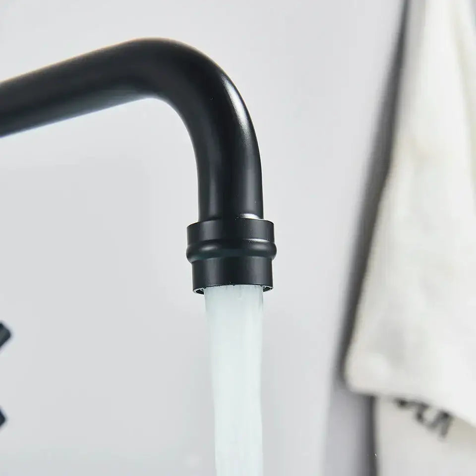 Matte black wall mounted kitchen faucet with swivel spout