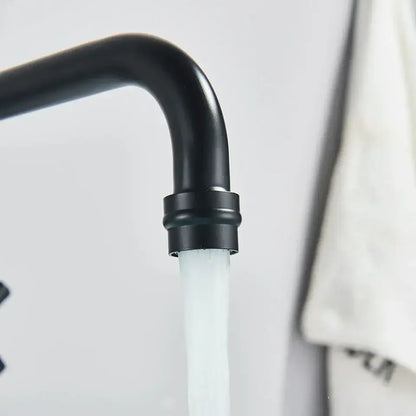 Matte black wall mounted kitchen faucet with swivel spout