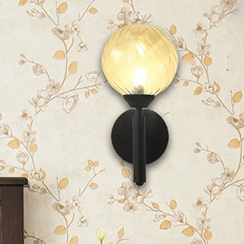 Modern black wall sconce with clear textured glass – bedroom light