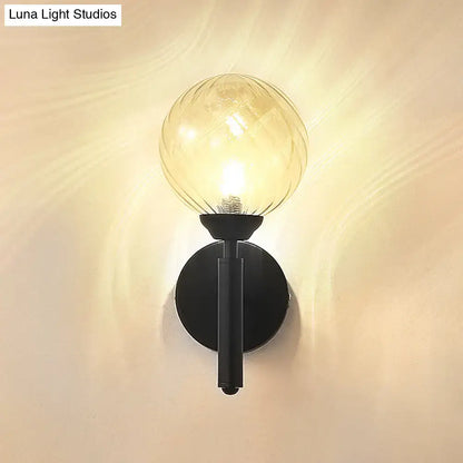 Modern black wall sconce with clear textured glass – bedroom light