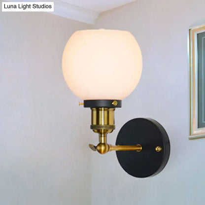Industrial brass wall sconce with bubble white glass for bedroom