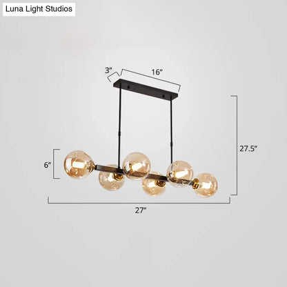 Modern black and brass globe shade pendant light for dining room
