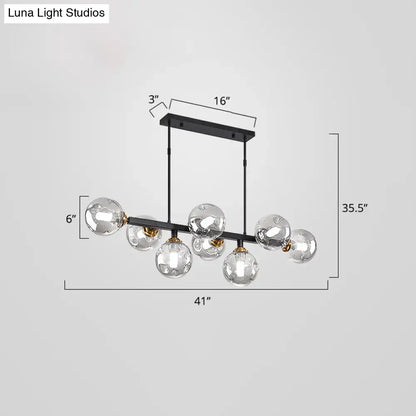 Modern black and brass globe shade pendant light for dining room