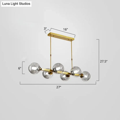 Modern black and brass globe shade pendant light for dining room