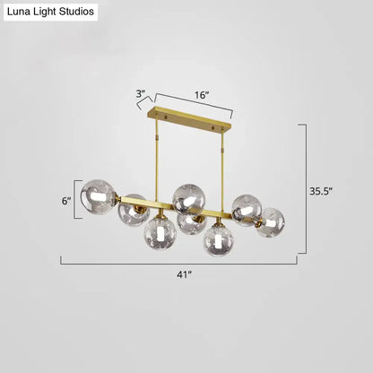 Modern black and brass globe shade pendant light for dining room
