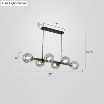 Modern black and brass globe shade pendant light for dining room