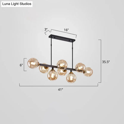 Modern black and brass globe shade pendant light for dining room
