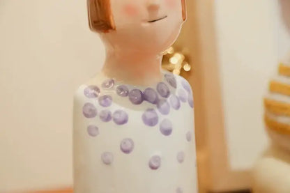 Stylized blue & purple people ceramic vase set living room decor