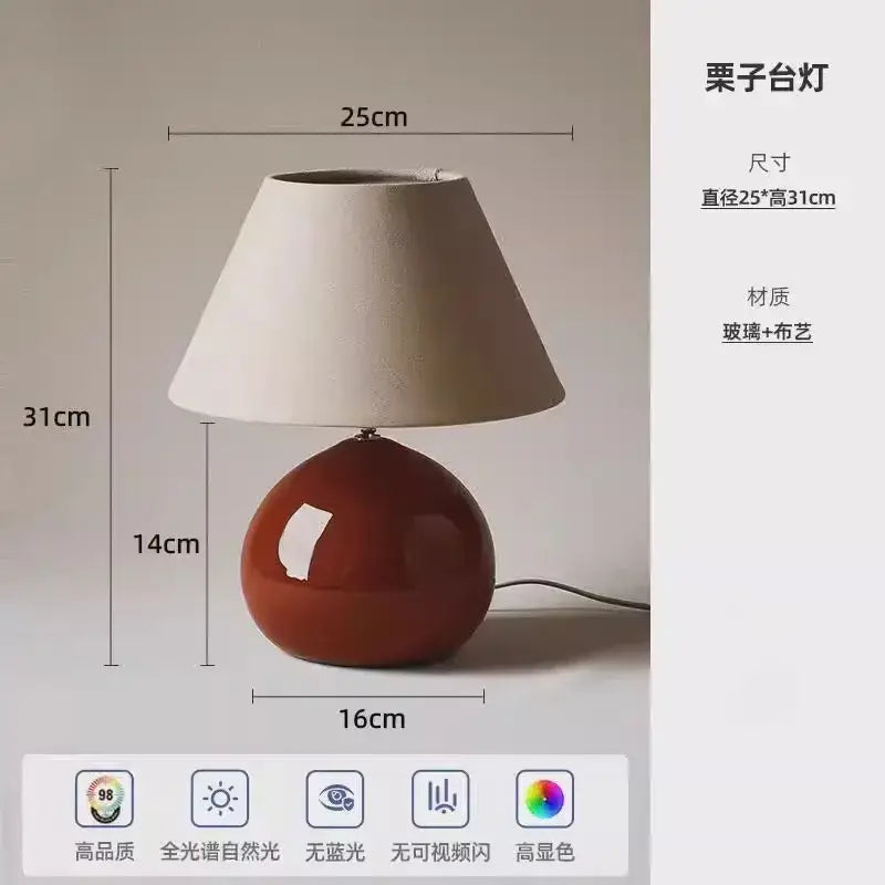 Red ceramic table lamp with beige shade for bedroom