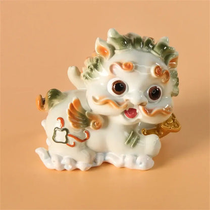 Yellow and turquoise ceramic mythology lion figurines living room decor