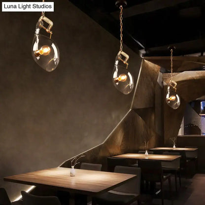 Modern brass and clear glass fish pendant light dining room