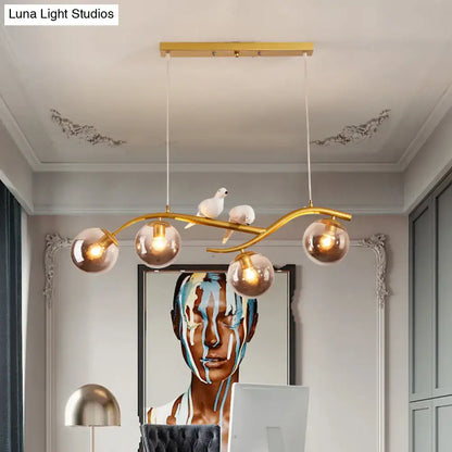 Modern branch gold & black dining room pendant smoke grey cognac glass