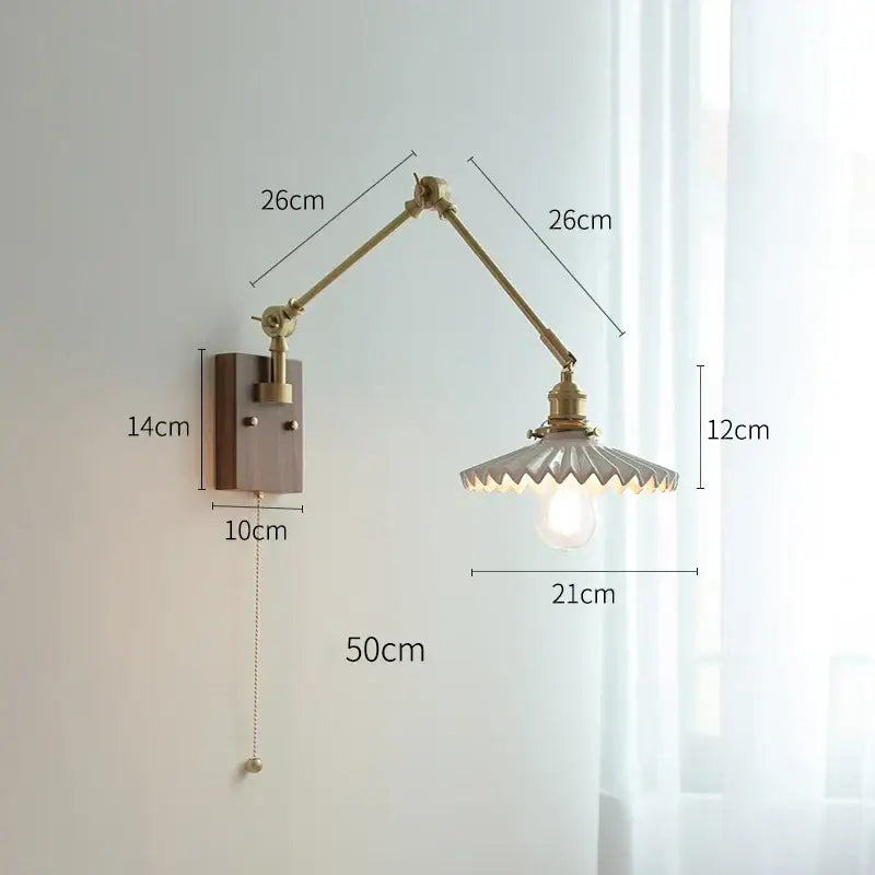 copper swing arm wall lamp with glass shade for bedroom