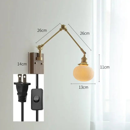 copper swing arm wall lamp with glass shade for bedroom