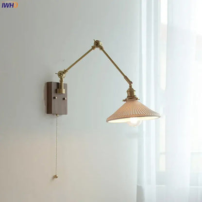 copper swing arm wall lamp with glass shade for bedroom