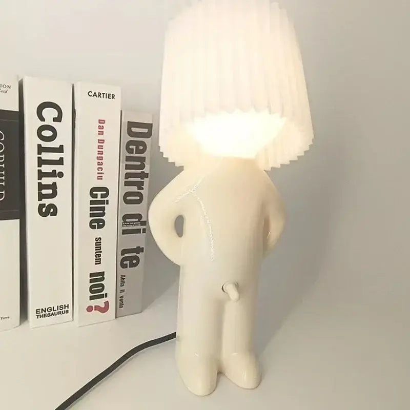 Whimsical beige and yellow naughty boy table lamp for bedroom bedside