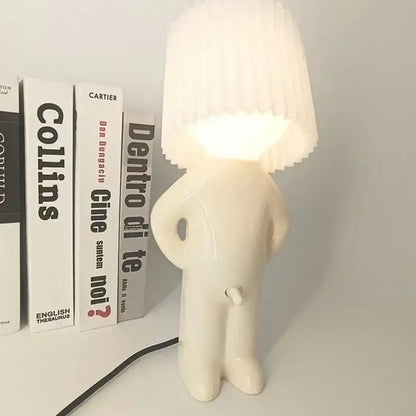 Whimsical beige and yellow naughty boy table lamp for bedroom bedside