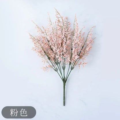Mint green ceramic vase with yellow lemon grass branch living room