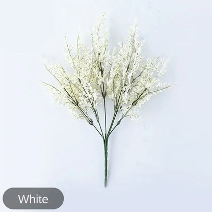 Mint green ceramic vase with yellow lemon grass branch living room