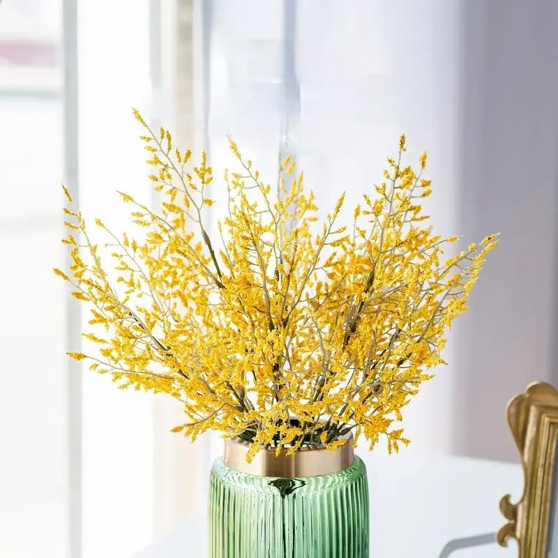 Mint green ceramic vase with yellow lemon grass branch living room