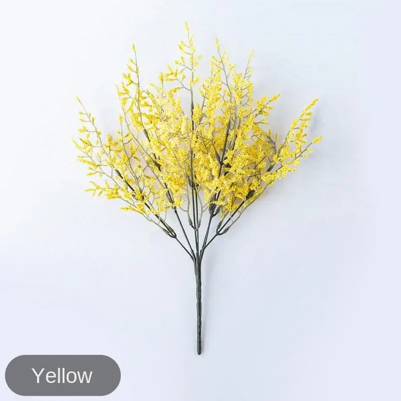 Mint green ceramic vase with yellow lemon grass branch living room