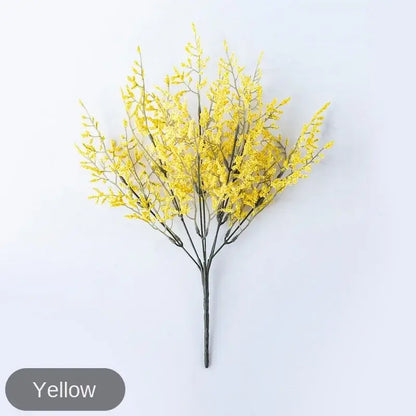 Mint green ceramic vase with yellow lemon grass branch living room