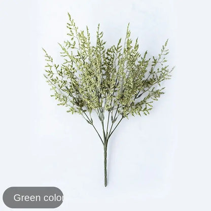 Mint green ceramic vase with yellow lemon grass branch living room
