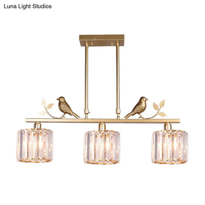 Black crystal prism island light fixture with leaf decor dining room