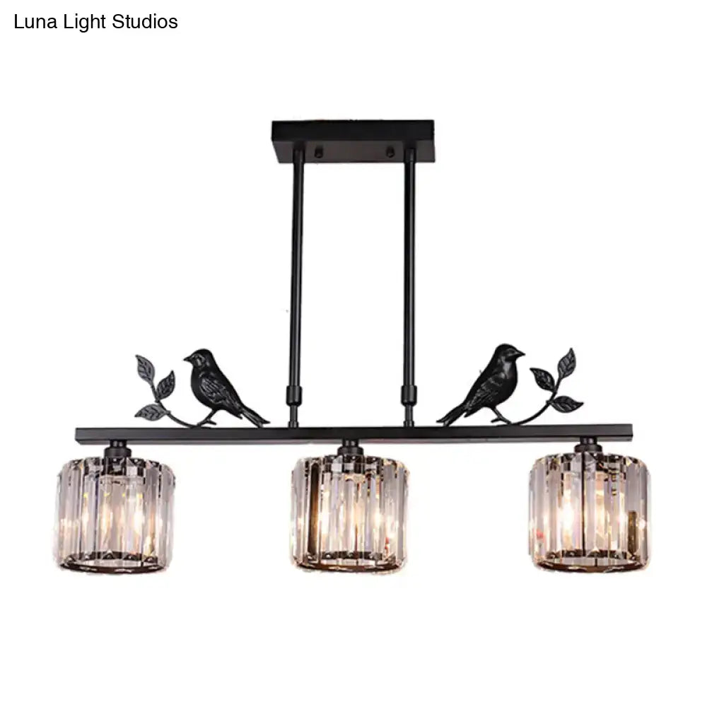 Black crystal prism island light fixture with leaf decor dining room