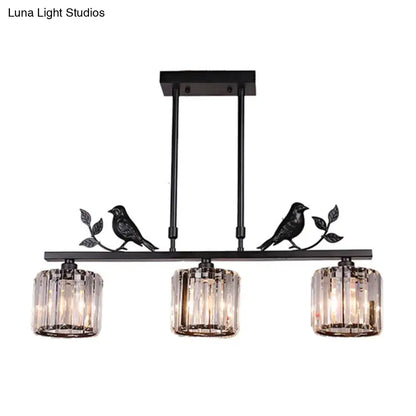 Black crystal prism island light fixture with leaf decor dining room