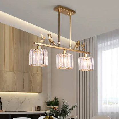 Black crystal prism island light fixture with leaf decor dining room