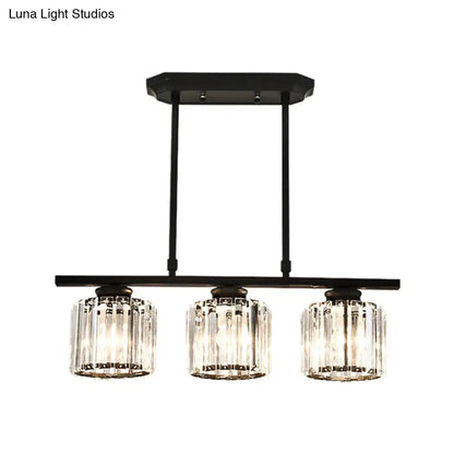 Simple black metal chandelier with three crystal shades dining room